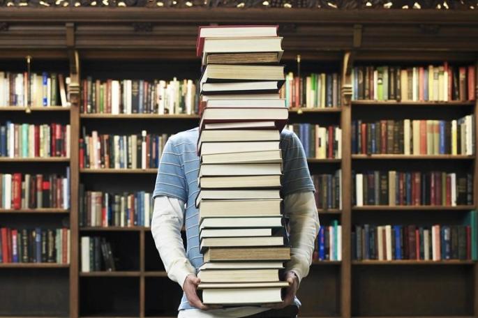 guy carrying books